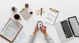 Photo of a woman using office supplies for work Photo by rawpixel.com from Pexels