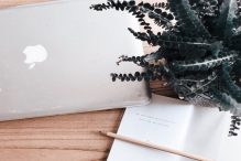 computer, planner and pencil on desk